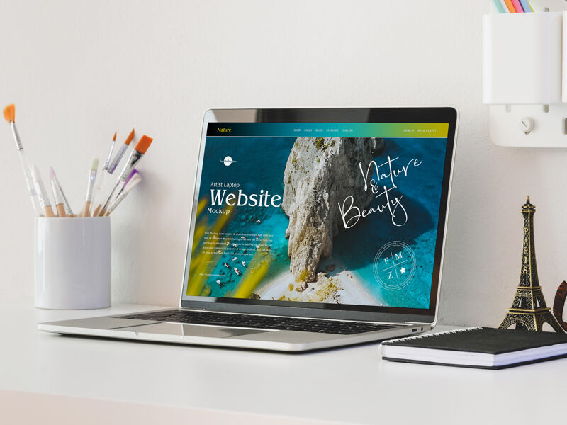 3/4 View Laptop on Table Mockup with Eiffel Tower Figurine FREE PSD