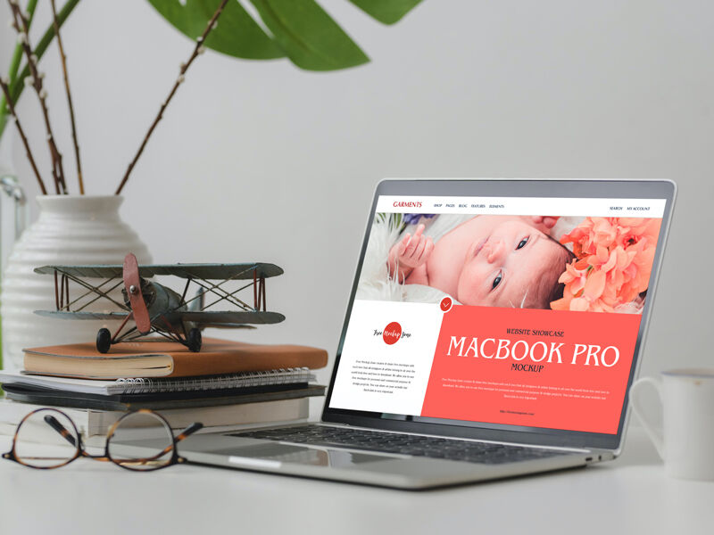 3/4 View MacBook Pro on Table Mockup with Books FREE PSD