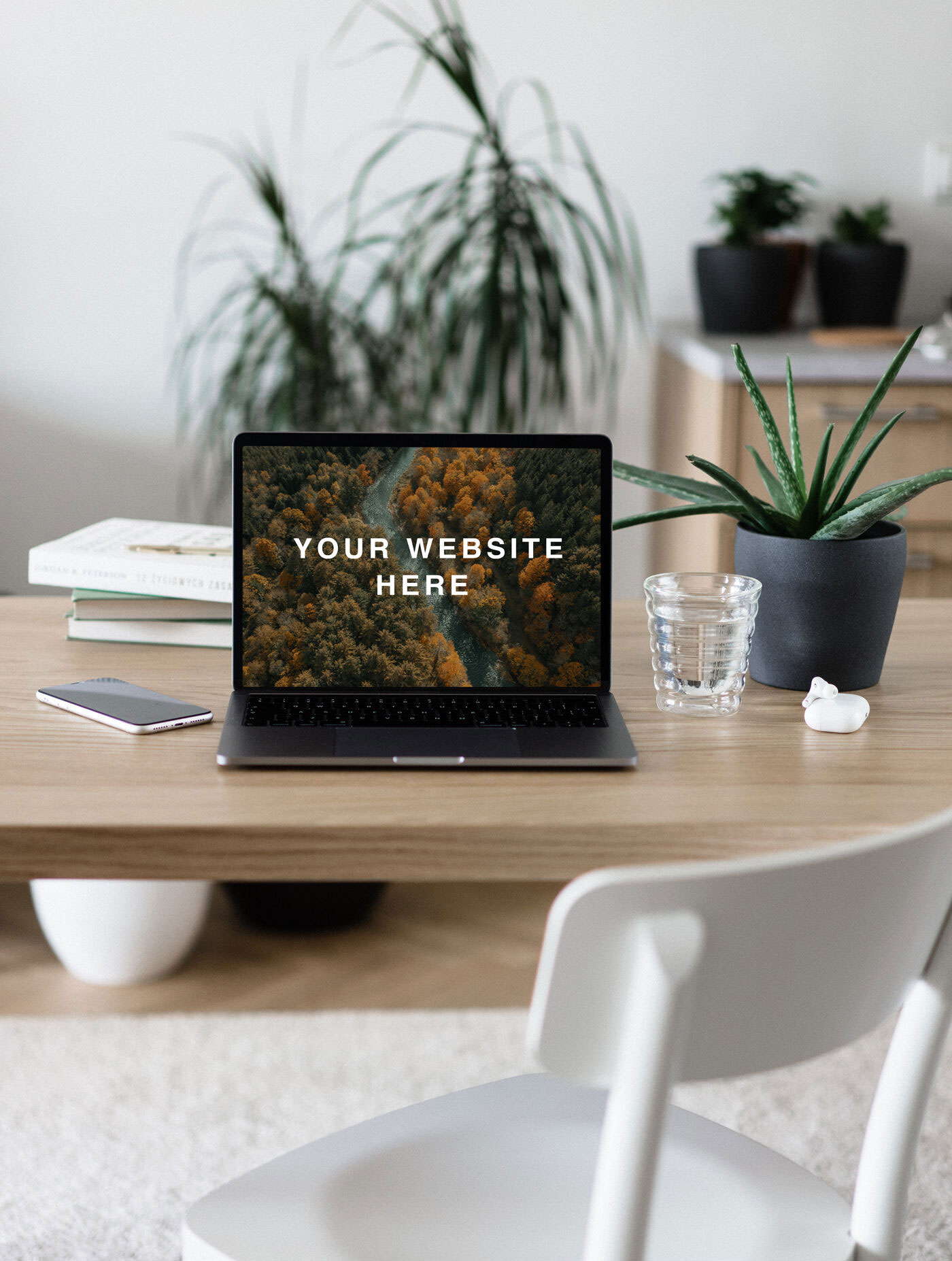 Mockup of a Front View MacBook Pro on Table FREE PSD